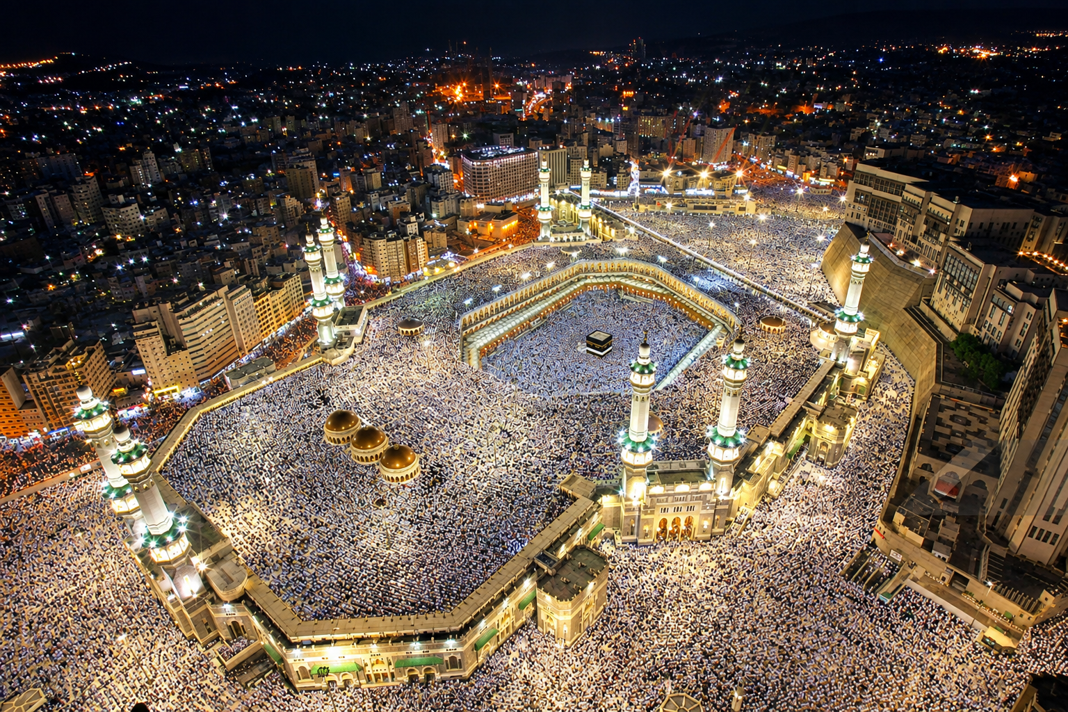 The Kaaba surrounded by pilgrims with the Makkah Clock Tower behind
